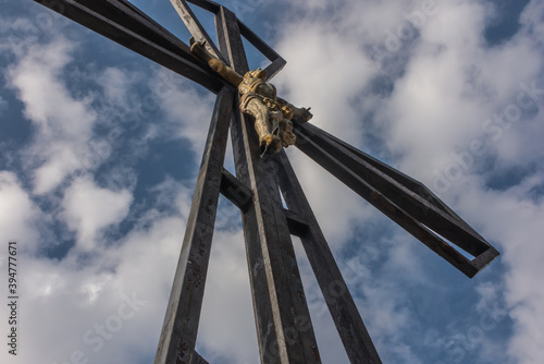 The cross on the background of clear sky at the top Biaklo (or Maly Giewont) near Olsztyn near Czestochowa photo