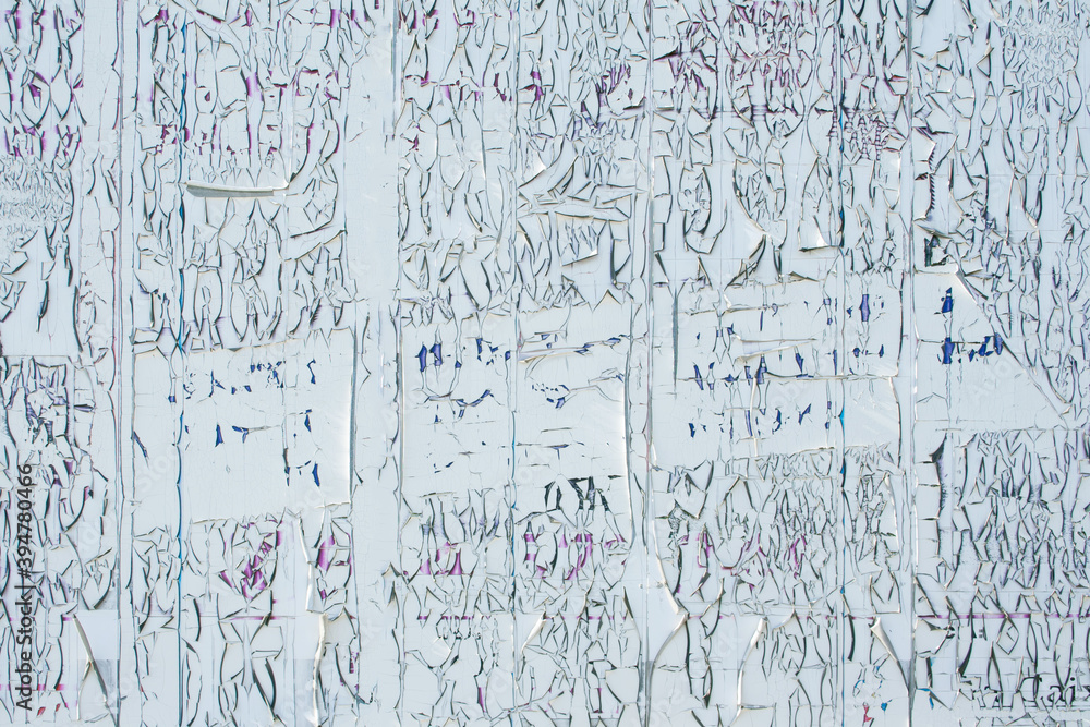 Background of old and torn posters, crumpled paper, texture and backgrounds.