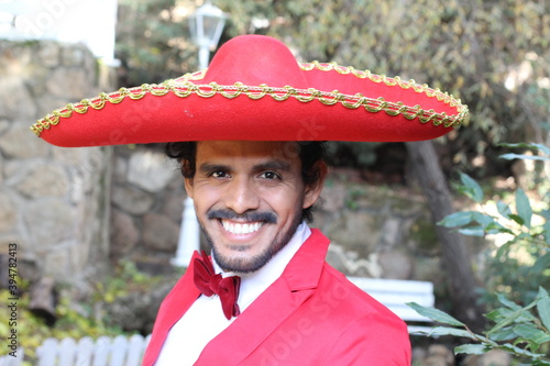 Handsome mariachi with red outfit  photo