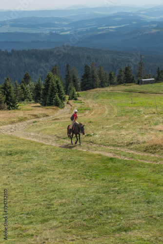 Hala Rysianka, Beskid Zywiecki, Poland, September 4, 2020: Mountain horseback riding in Beskid Zywiecki near the Hala Rysianka