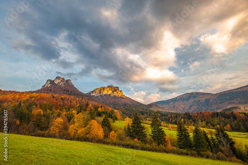 Autumn rural landscape with mountains peaks on background. The Vratna valley in Mala Fatra national park, Slovakia, Europe.