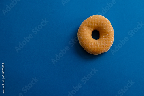 a donut on blue background