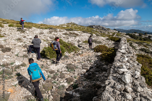 hikers ascending through Sierra Son Moragues, Valldemossa, Mallorca, Balearic Islands, Spain photo