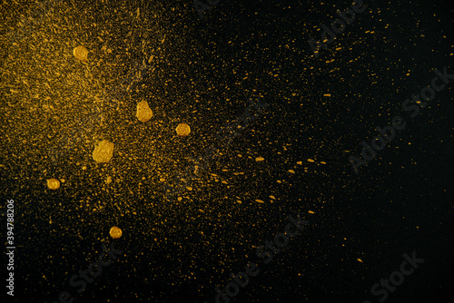 Golden drops on a black background.