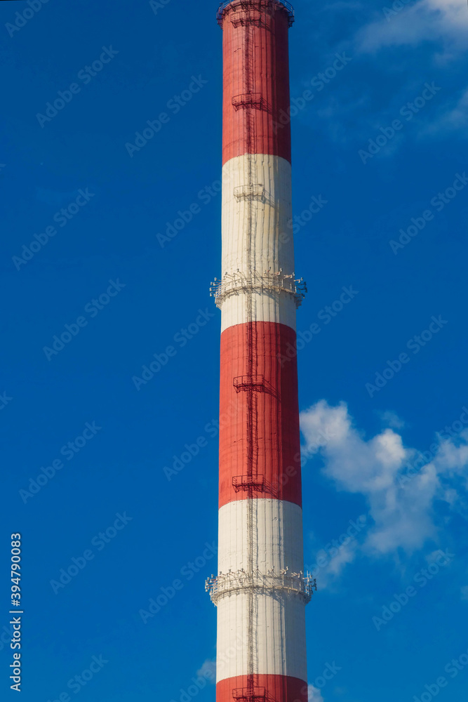 A Big Striped red white industrial chimney A Big Striped red white industrial chimney