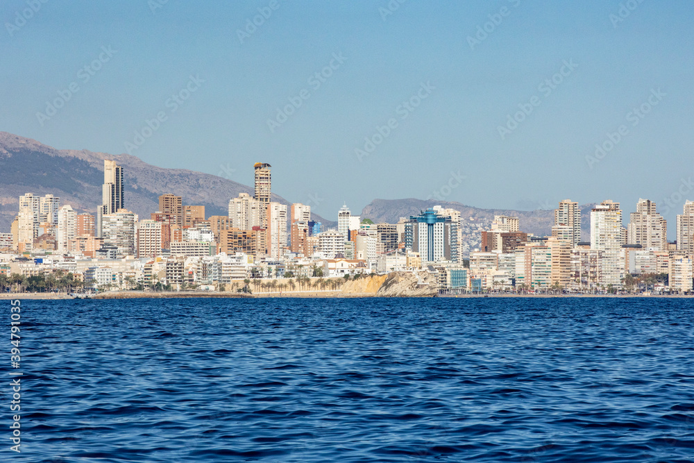 ciudad de Benidorm al atardecer vista desde el agua España ciudad de Benidorm al atardecer vista desde el agua España