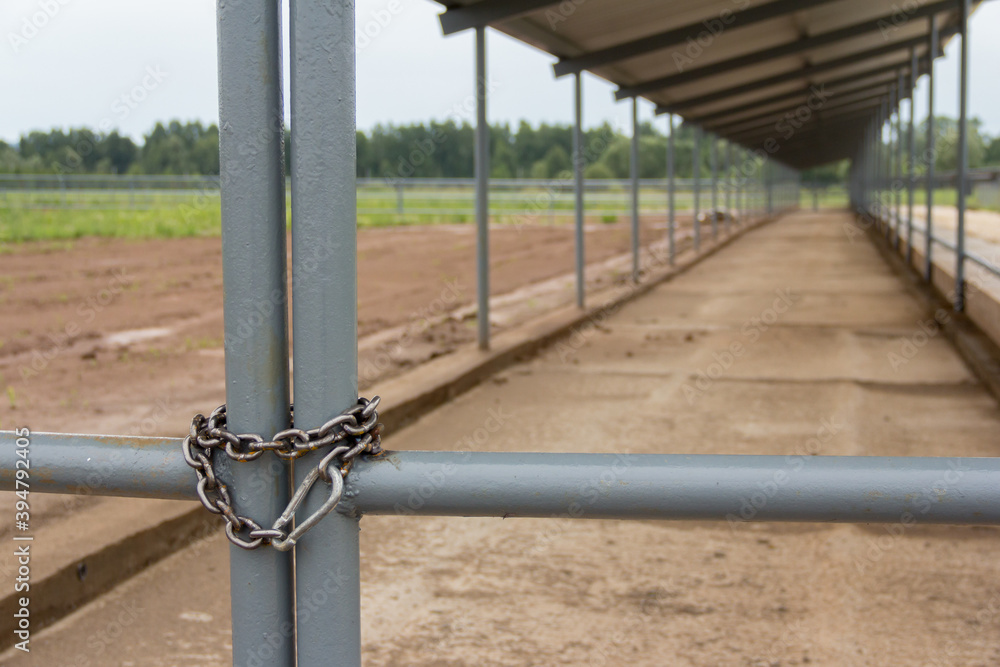 Chain wound around the gate at the entrance. Closed area. No way Chain wound around the gate at the entrance. Closed area. No way