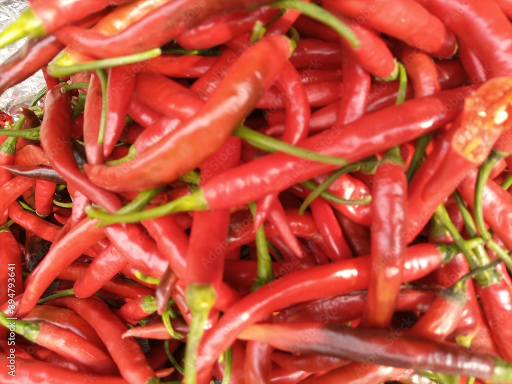 curly red chilies sold in traditional markets