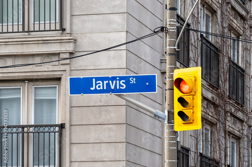 Photography Jarvis Street sign with traffic light is seen in downtown Toronto, Canada