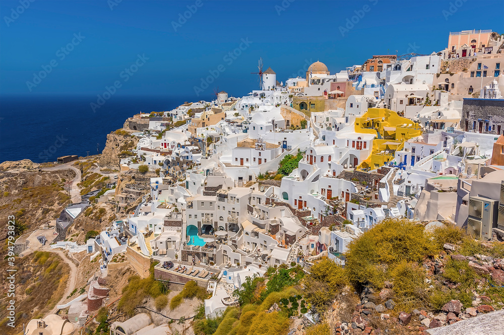 A view across the northern edge of the village of Oia, Santorini in summertime