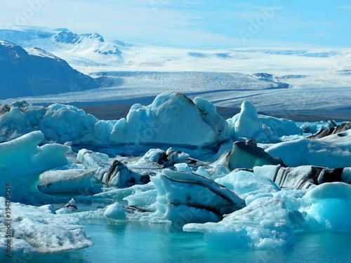 iceberg and ice floes in jokulsarlon lagoon, sparkling blue snow, winter fairy tale.