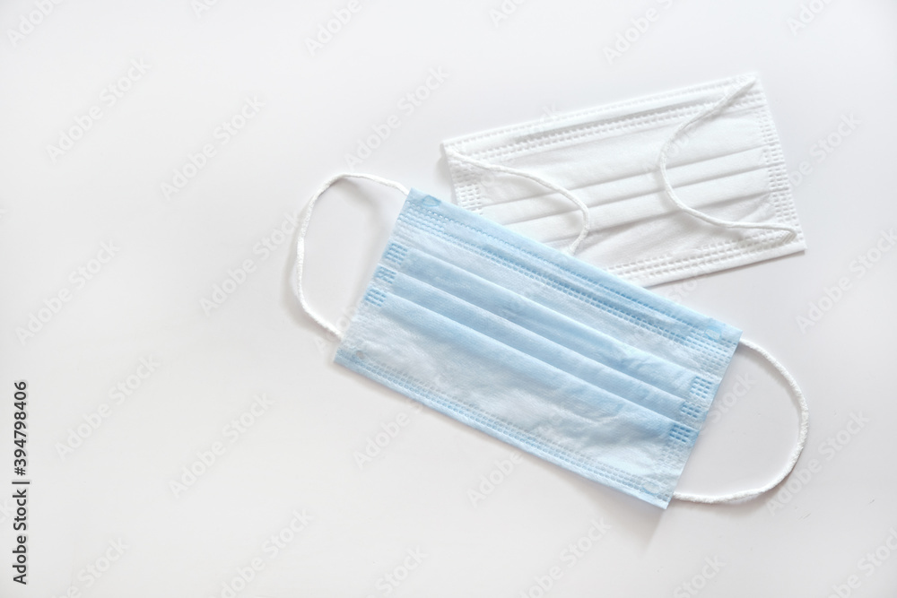 Medical mask on white background. Coronavirus protection. Hygiene and healthcare theme. Medical mask on white background. Coronavirus protection. Hygiene and healthcare theme.
