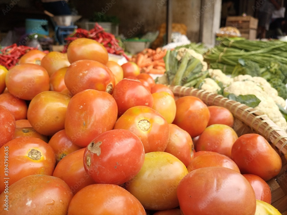 vegetables in traditional markets. tomatoes, cucumbers, carrots, broccoli, red squash, white squash, and many other vegetables