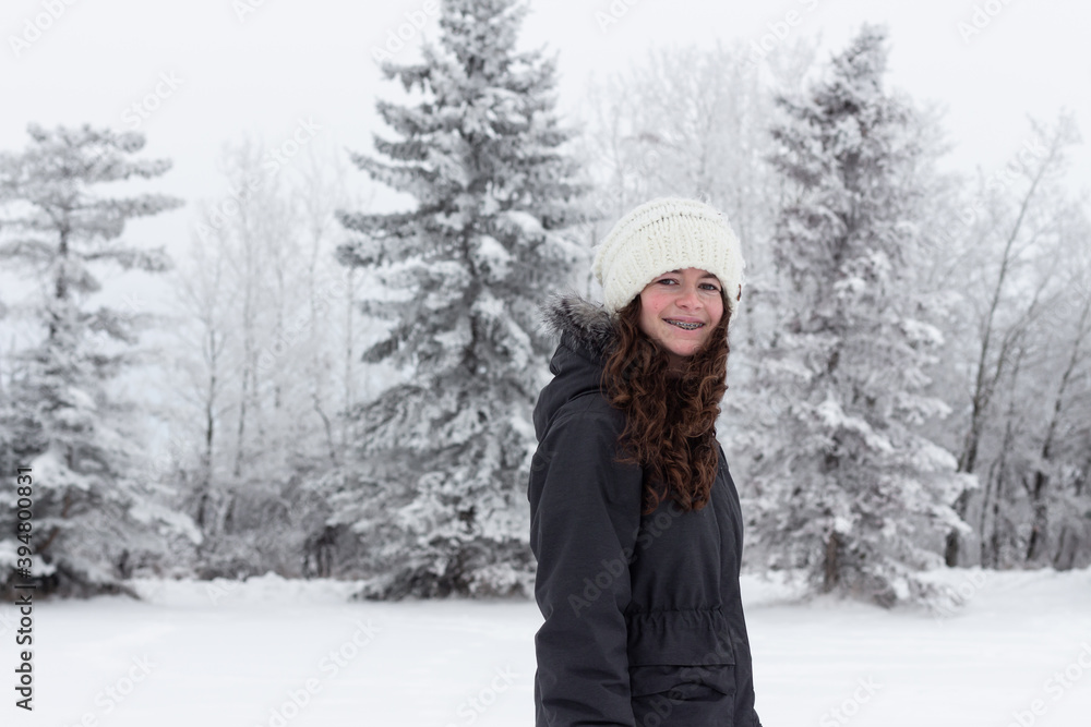 girl enjoying frosty and foggy winter scene with snow and frost girl enjoying frosty and foggy winter scene with snow and frost