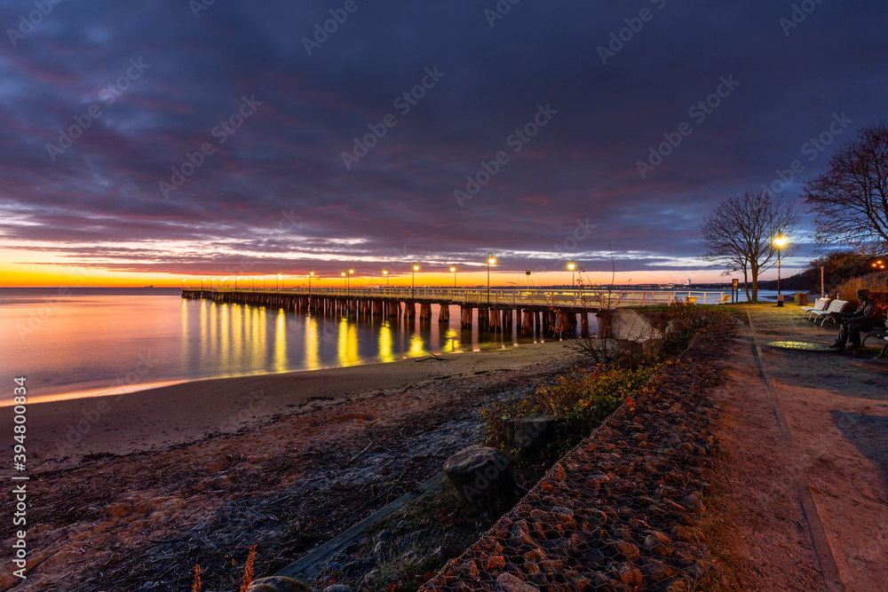 Fototapeta premium Beautiful landscape with wooden pier in Gdynia Orlowo before sunrise, Poland