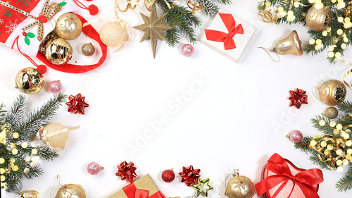 Christmas background and New Year concept, frame made of fir branches, gift boxes and beautiful holiday decorations, postcard, winter banner, place for text, selective focus