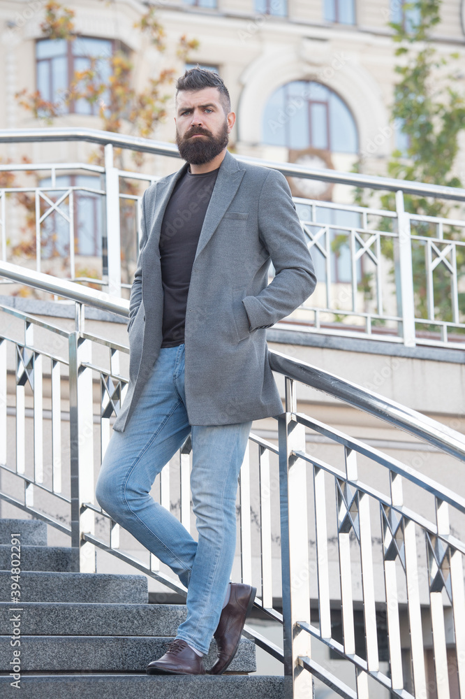 Looking trendy. brutal mature hipster in autumn jacket. male with groomed facial hair. guy with stylish hairstyle. hair and beard care. charismatic business man with beard. walk outdoor. bearded man Looking trendy. brutal mature hipster in autumn jacket. male with groomed facial hair. guy with stylish hairstyle. hair and beard care. charismatic business man with beard. walk outdoor. bearded man