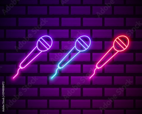 Karaoke colours glowing neon ui ux icons. Glowing sign logo vector . Microphone neon icon isolated on dark brick wall backround