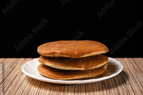 Wallpaper Mural Stack of 3 pancakes on white plate with a dark background  Torontodigital.ca