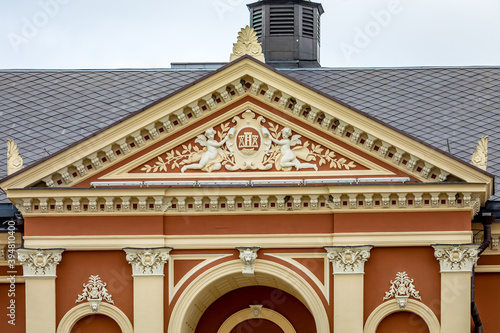 Ornate pediment above the entrance of the Drama Theatre in Klaipeda, Lithuania photo