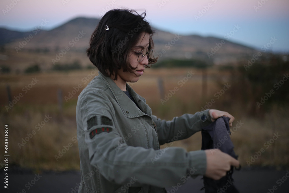 portrait of a young woman traveler, mexican woman, mountains