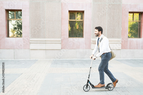 Wallpaper Mural Happy businessman using an eco-friendly vehicle Torontodigital.ca