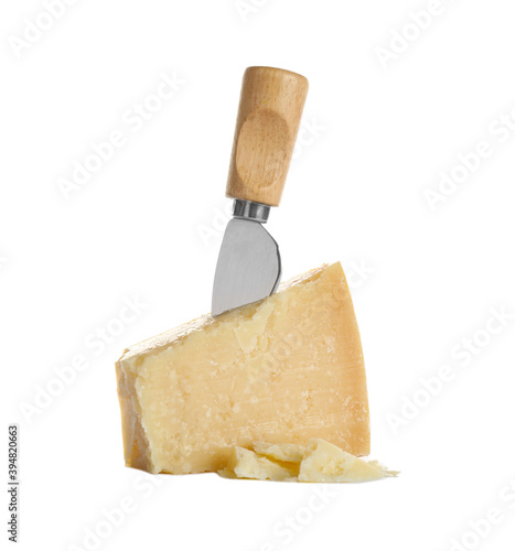 Piece of Parmesan cheese and knife on white background