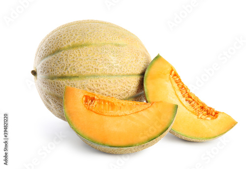 Tasty fresh cut and whole melons isolated on white