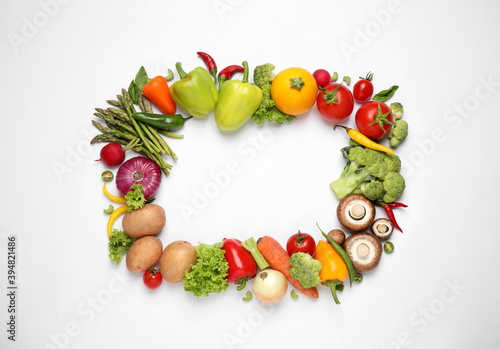 Frame of fresh vegetables on white background  flat lay. Space for text