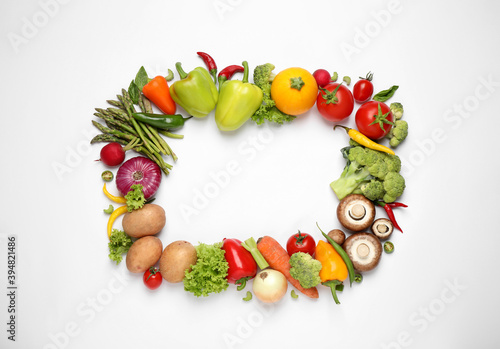 Frame of fresh vegetables on white background, flat lay. Space for text