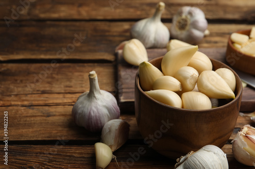 Fresh organic garlic on wooden table, closeup
