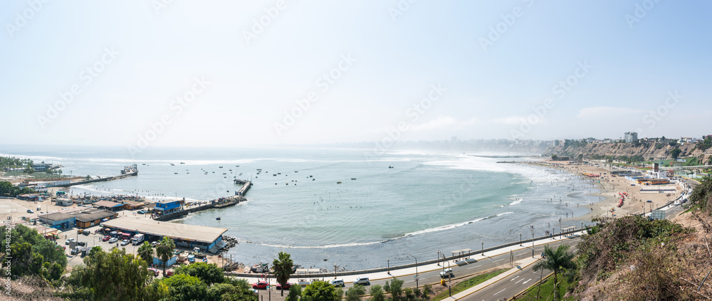 Aerial view of chorrillos beach and port against the backdrop of the city in Lima, Peru