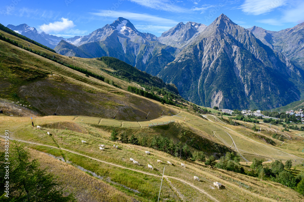 Obraz premium Landscape with view on ski station Les deux Alpes and Alpine mountains peaks in summer, Isere, France