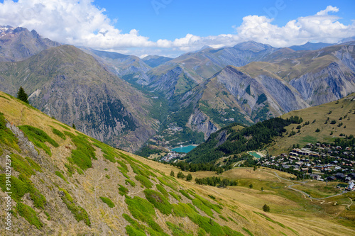 Hiking near ski station Les deux Alpes and view on Alpine mountains peaks in summer  Isere  France