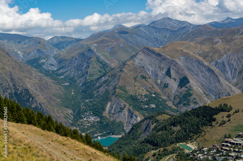 Hiking near ski station Les deux Alpes and view on Alpine mountains peaks in summer, Isere, France © barmalini