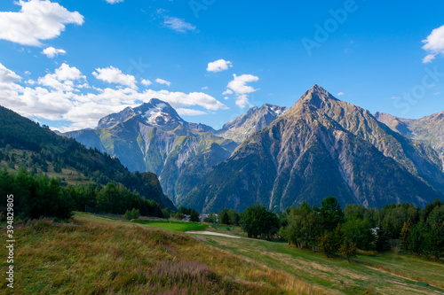 View on ski station Les deux Alpes and Alpine mountains peaks in summer, Isere, France