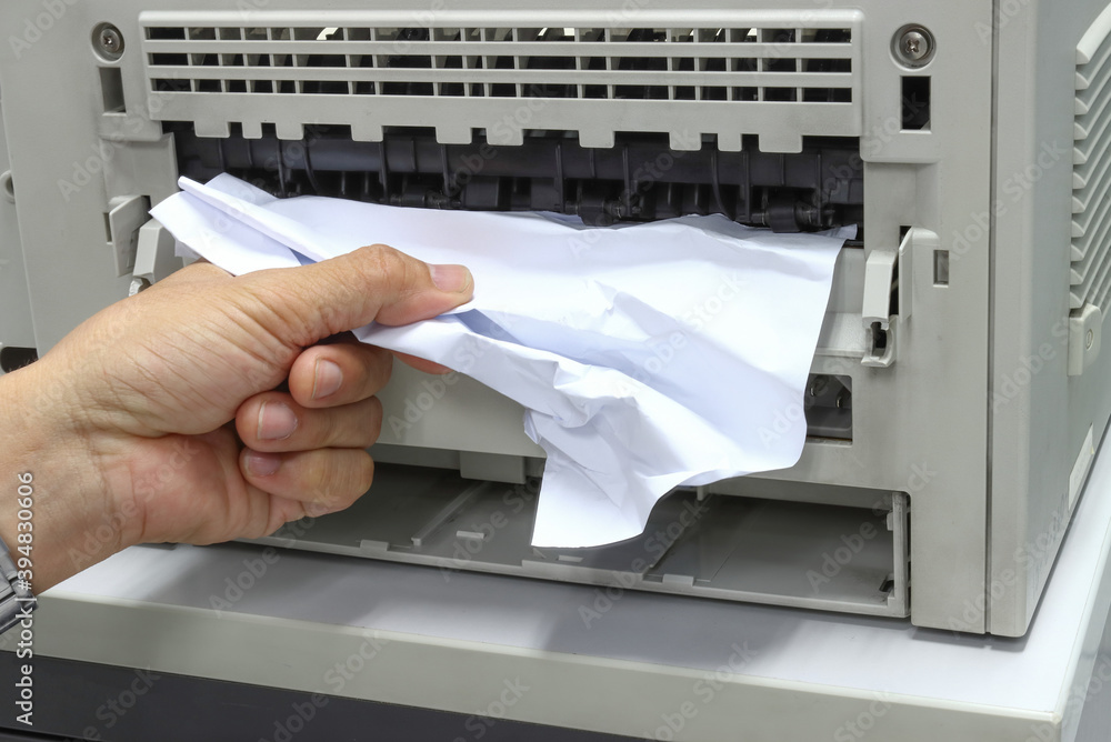 Technicians Removing Paper Stuck, Paper Jam In Printer At Office Technicians Removing Paper Stuck, Paper Jam In Printer At Office