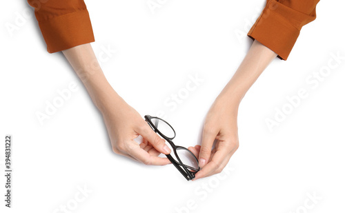 Woman with glasses on white background, top view. Closeup of hands