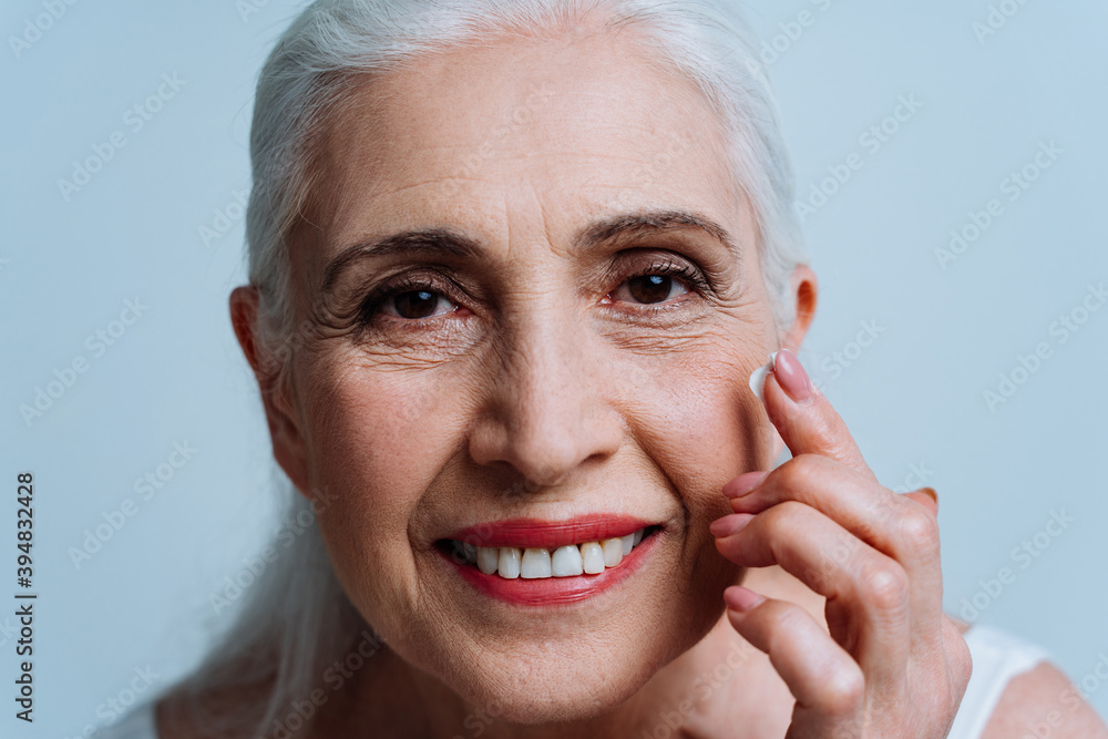 Beautiful senior woman posing on a photoshooting Beautiful senior woman posing on a photoshooting