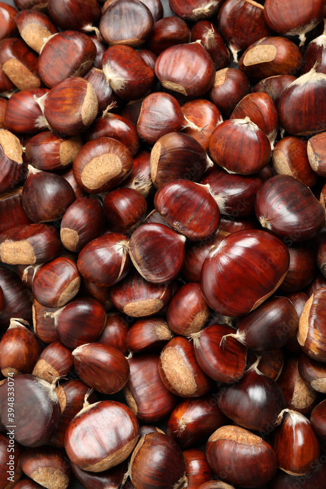 Top view of fresh edible sweet chestnuts as background, closeup Top view of fresh edible sweet chestnuts as background, closeup
