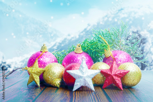 Christmas decorations with colorful ornaments on wooden table