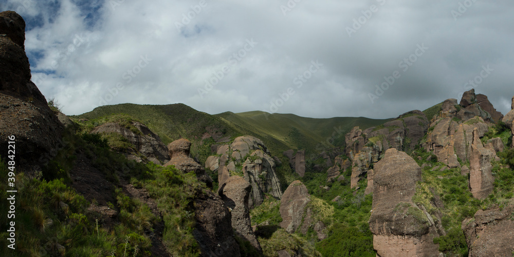 Naklejka premium The Moon Valley. Panorama view of the mountains, green forest and rock formations called Los Terrones, in Cordoba, Argentina.