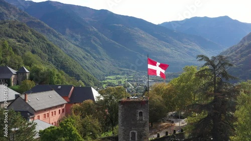 Aerial shot of the pretty old town (Conflans) overlooking Albertville, beautiful view of an old city surrounded by mountains,  View of the Conflans, the medieval city located in upper savoy, France photo