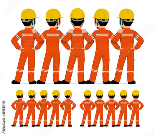 Five industrial workers standing together on white background