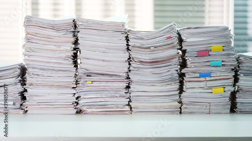 Fotografia Papers piles, document stacked on working desk table at office room