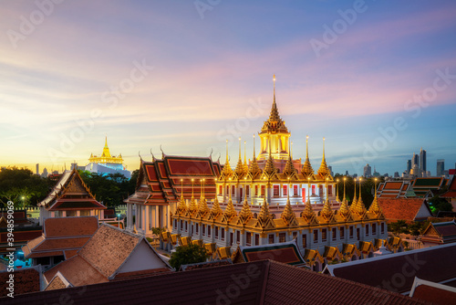 Golden metal castle illuminated, Wat Ratchanatdaram Woravihara, Loha Prasat temple in the morning at Bangkok city, Thailand