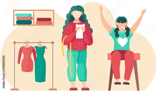 Colleagues in atelier with the model of future garment. Professional tailoring studio. Sewing clothes. Woman planning pattern. Person stands with sheet of paper. Little girl joyfully raises her hands