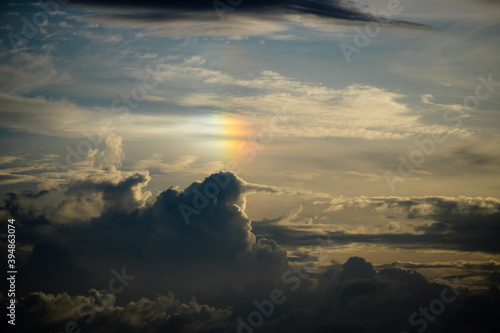 Surreal rainbow appearing in mysterious clouds