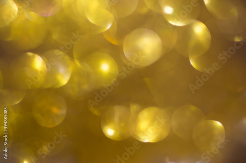 Shimmering blur spot light on yellow color background  Christmas concept