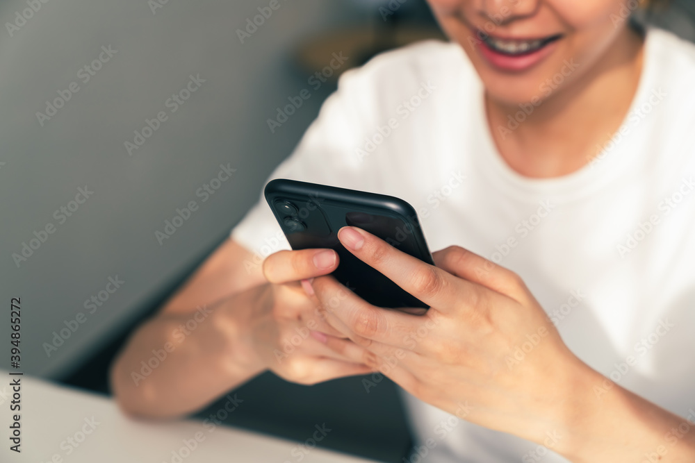 Woman using smartphone, During leisure time. The concept of using the phone is essential in everyday life. Woman using smartphone, During leisure time. The concept of using the phone is essential in everyday life.